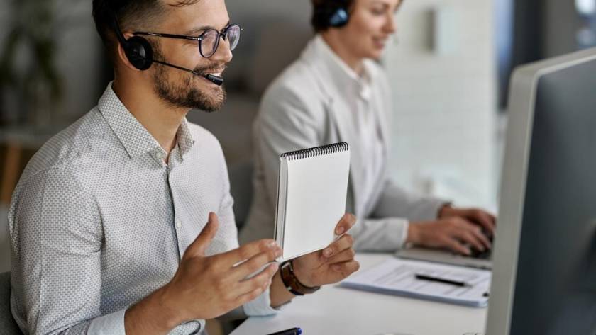 A diverse team of call center agents with headsets, ready to provide a wide range of call center services